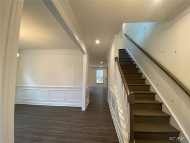 FOYER; OAK-STAINED STAIRS