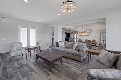Living room featuring a chandelier, recessed light
