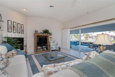 Great room with vaulted ceiling, wall of sliding d