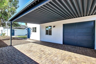 1 car garage + 2 car covered gated!
