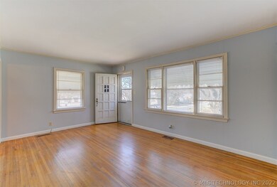 Living room with original hardwoods.
