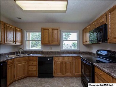Terrifically updated kitchen with new flooring, appliances and countertops.