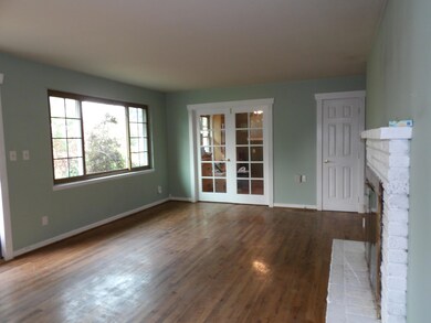 living room to 3rd bedroom french doors