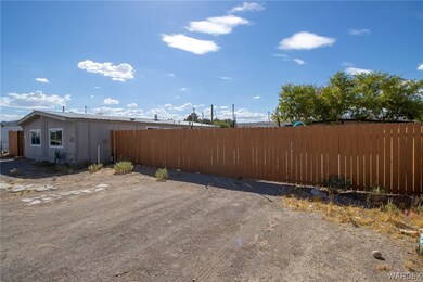 View of front yard and parking space.