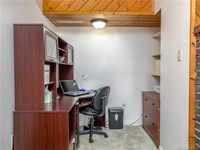 Office nook on far end of living room.