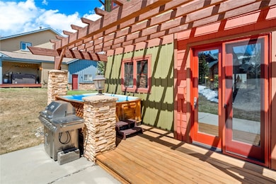 Wooden deck with a grill and a pergola
