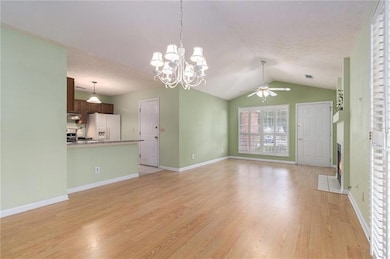 Kitchen and breakfast bar open to living areas