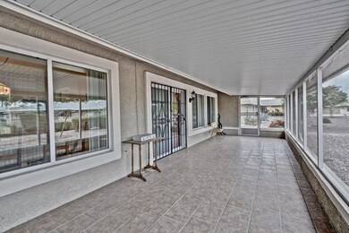 TILED SCREENED IN BACK PATIO
