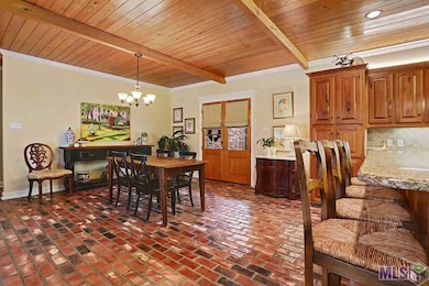Brick floors, beaded board ceilings with beams