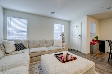 Living room featuring hardwood / wood-style floori