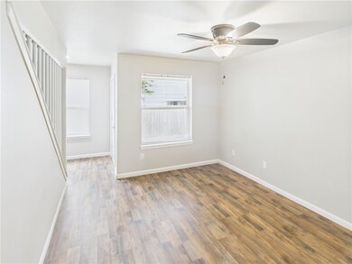Unfurnished room featuring baseboards, wood finish