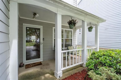 View of exterior entry with a porch