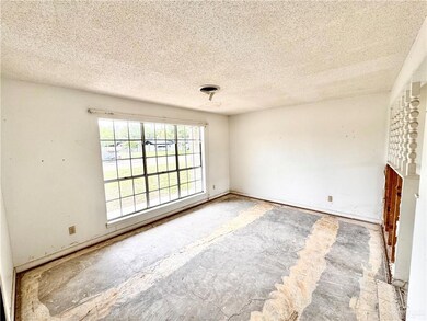 Living room with a textured ceiling