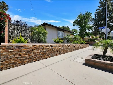 Great curb appeal with stacked stone retaining wall.