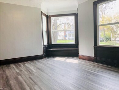 LIVING ROOM! HUGE BRAND NEW WINDOWS!
