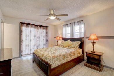 Master Bedroom w Private Exit to Patio
