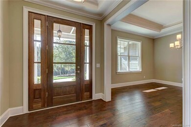 Gorgeous wooden and glass front door to welcome gu