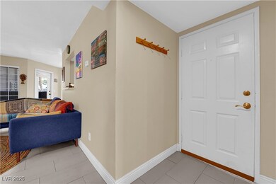 Entryway featuring light tile patterned floors and