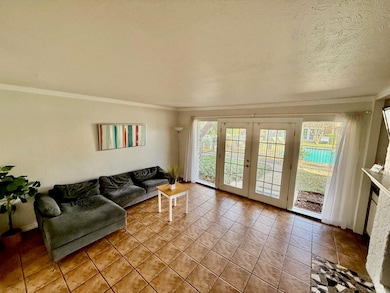 Bright living room with ceiling to floor windows a