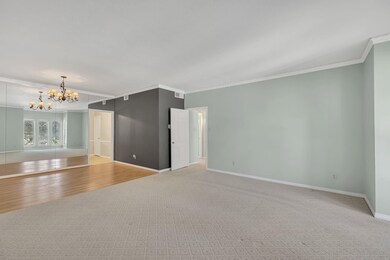 Living Room and Dining Room showing chandelier and