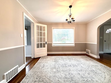Oversized dining room with hardwood floors