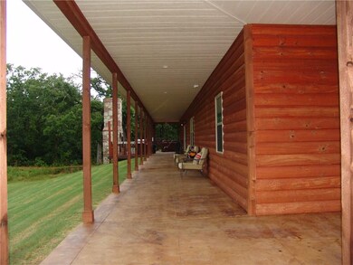 The porch goes all the way around the house