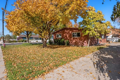 View of front of home featuring a front yard and brick siding
