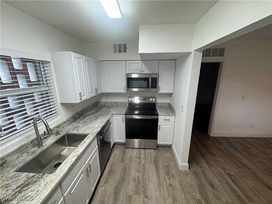 Kitchen with new granite countertops.