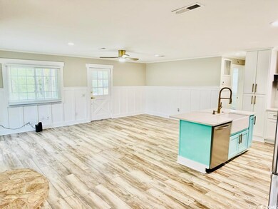 Kitchen featuring light hardwood / wood-style floo