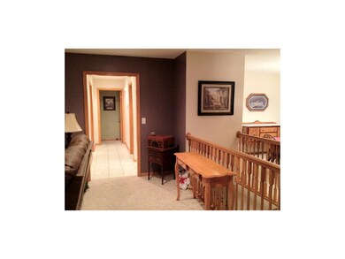 Hallway Past Kitchen on Left and Laundry on Right 