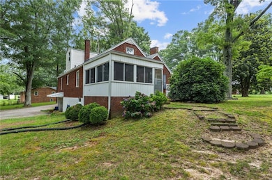 Huge sunroom on back side of property.