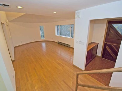 Living Room. This view is from the stairway.  Love