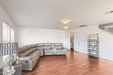 Living room with dark hardwood / wood-style floori