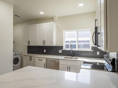 Kitchen with stainless steel appliances, washer /