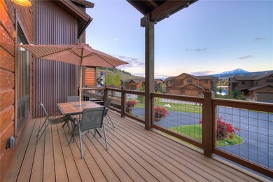 The large front deck has beautiful mountain and la