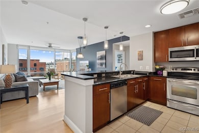 Kitchen with open floor plan, peninsula, visible v