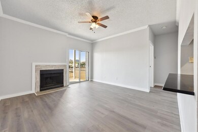 Unfurnished living room featuring wood finished f