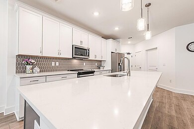 Kitchen featuring light wood-style flooring, appli