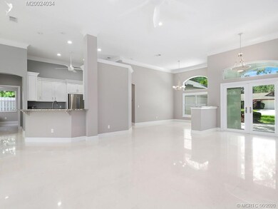 Open kitchen to living room with breakfast bar per