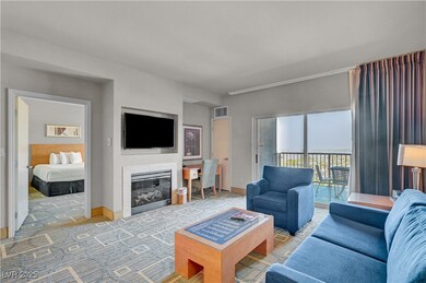 Living area showing TV, fireplace and work corner