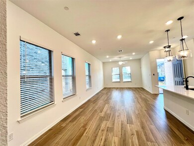 Unfurnished living room featuring visible vents, a ceiling fan, wood finished floors, recessed lighting, and baseboards