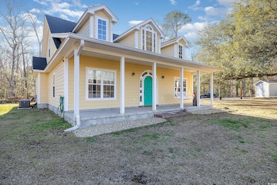 View of front of property featuring covered porch,