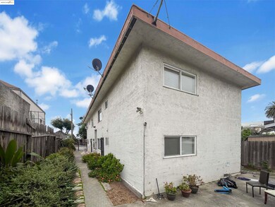 Back of property with a patio area and stucco siding
