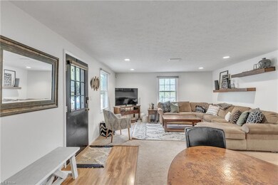 Living room featuring a textured ceiling and light