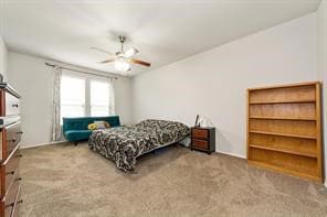 Bedroom with light colored carpet and a ceiling fan