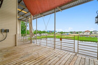 Private rear patio overlooking waterway, and lower