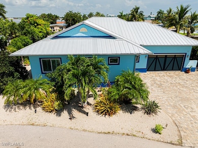 View of front of home with a garage, stucco siding