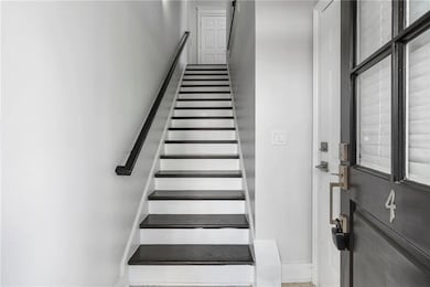 Stairway featuring baseboards
