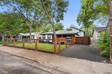 View of front of home featuring a gate