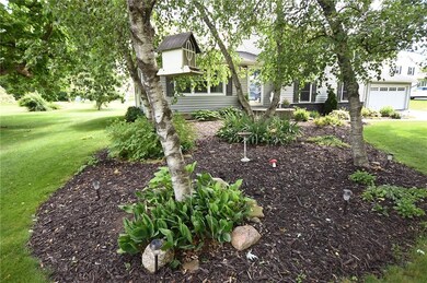 Lovely Gardens and Trees grace the Front Yard